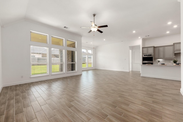 6518 Fairway Glen Ln, Katy, TX 77493 - unfurnished living room with baseboards, visible vents, light wood-type flooring, and ceiling fan