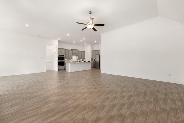 6518 Fairway Glen Ln, Katy, TX 77493 - unfurnished living room with baseboards, recessed lighting, ceiling fan, and light wood finished floors