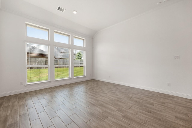 6518 Fairway Glen Ln, Katy, TX 77493 - empty room with baseboards, visible vents, light wood finished floors, and vaulted ceiling