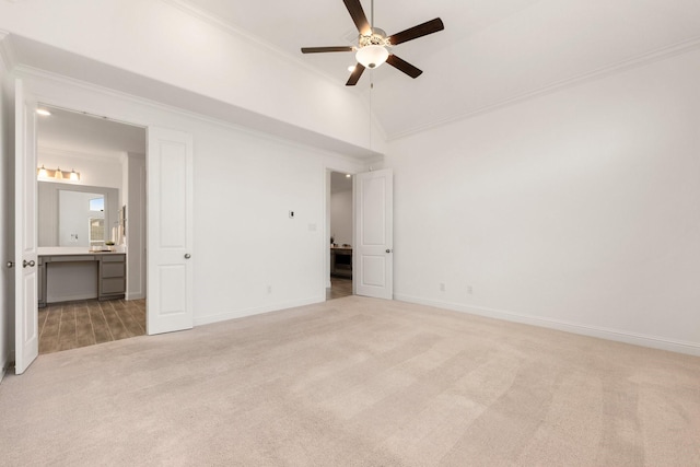 6518 Fairway Glen Ln, Katy, TX 77493 - unfurnished bedroom featuring lofted ceiling, connected bathroom, crown molding, baseboards, and light carpet