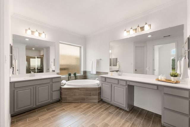 6518 Fairway Glen Ln, Katy, TX 77493 - bathroom with a garden tub, a sink, a shower stall, and ornamental molding