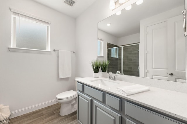 6518 Fairway Glen Ln, Katy, TX 77493 - full bath with a shower stall, vanity, visible vents, baseboards, and wood finished floors