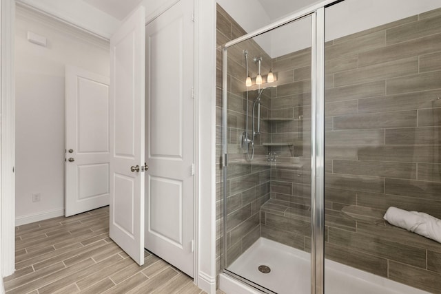 6518 Fairway Glen Ln, Katy, TX 77493 - full bathroom featuring wood finished floors, a stall shower, and baseboards