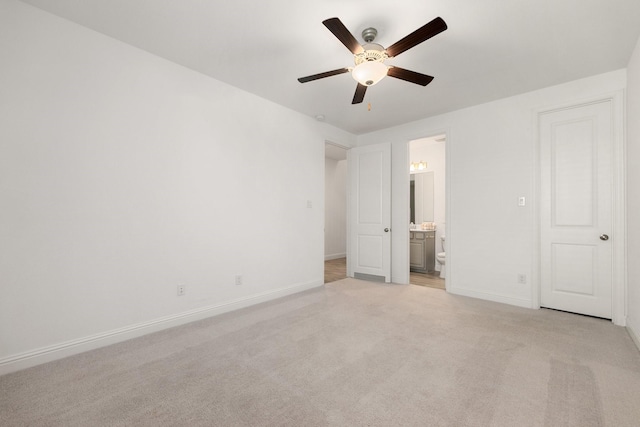 6518 Fairway Glen Ln, Katy, TX 77493 - unfurnished bedroom featuring ceiling fan, light carpet, ensuite bath, and baseboards