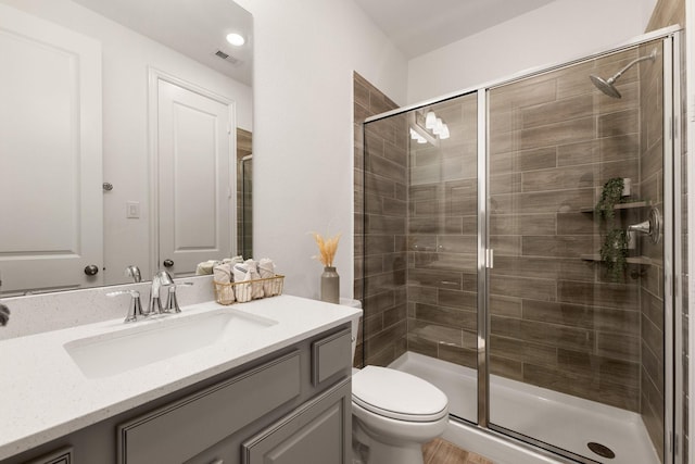 6518 Fairway Glen Ln, Katy, TX 77493 - full bathroom with toilet, visible vents, a shower stall, and vanity