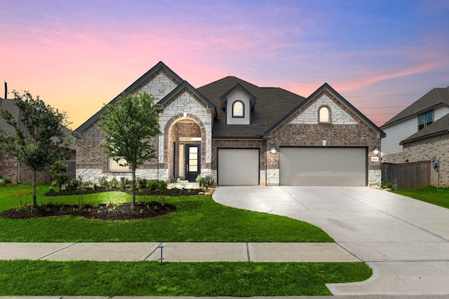 6518 Fairway Glen Ln, Katy, TX 77493 - french provincial home with concrete driveway, a yard, stone siding, and fence
