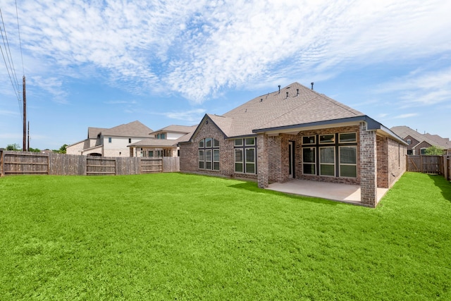 6518 Fairway Glen Ln, Katy, TX 77493 - back of house featuring a patio, roof with shingles, a lawn, brick siding, and a fenced backyard