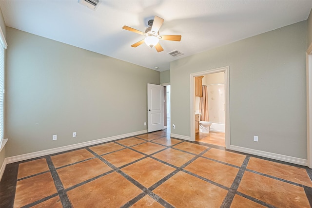 unfurnished bedroom featuring visible vents, baseboards, connected bathroom, and ceiling fan
