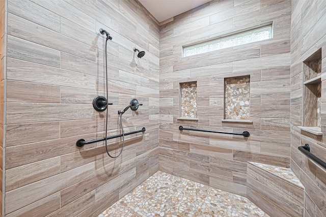 full bath with a tile shower