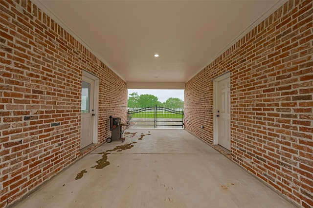 view of patio with a carport and a gate