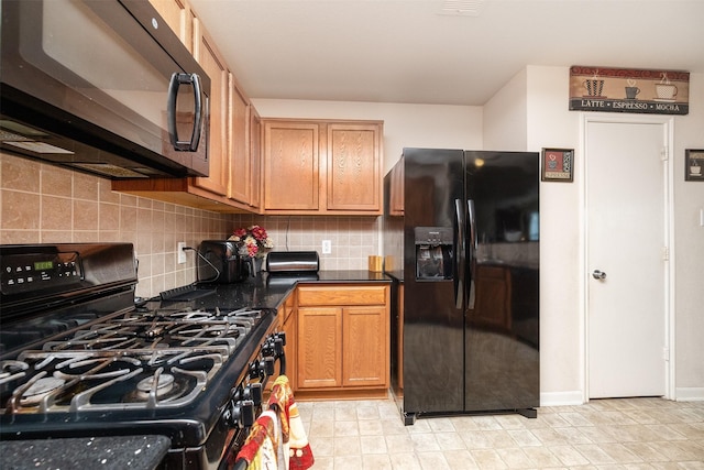 22110 Orchard Dale Dr, Spring, TX 77389 - kitchen with tasteful backsplash, dark countertops, and black appliances