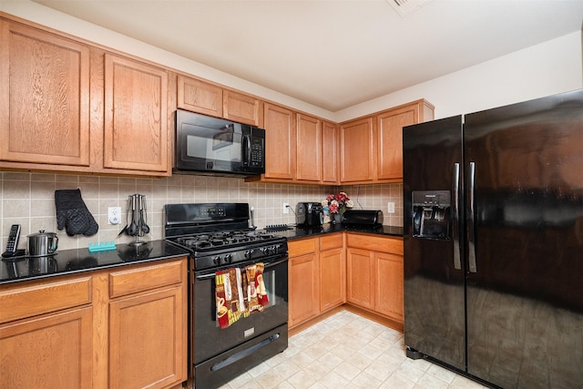 22110 Orchard Dale Dr, Spring, TX 77389 - kitchen featuring tasteful backsplash, brown cabinetry, and black appliances
