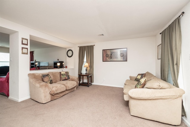 22110 Orchard Dale Dr, Spring, TX 77389 - living room featuring carpet floors, baseboards, and visible vents