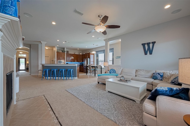 9422 Pearl Creek Ln, Katy, TX 77494 - living room featuring visible vents, a ceiling fan, decorative columns, recessed lighting, and light carpet