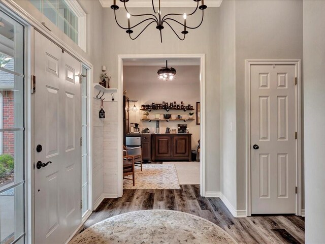 3065 S Fm 1194, Lufkin, TX 75904 - entrance foyer with dark wood-type flooring, baseboards, and an inviting chandelier