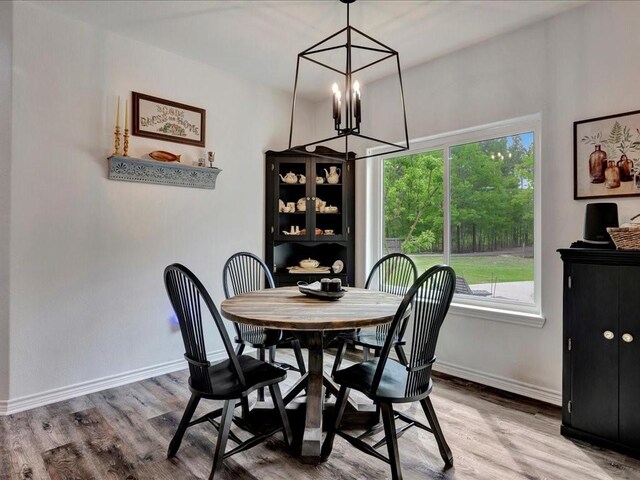 3065 S Fm 1194, Lufkin, TX 75904 - dining space with baseboards, wood finished floors, and a chandelier