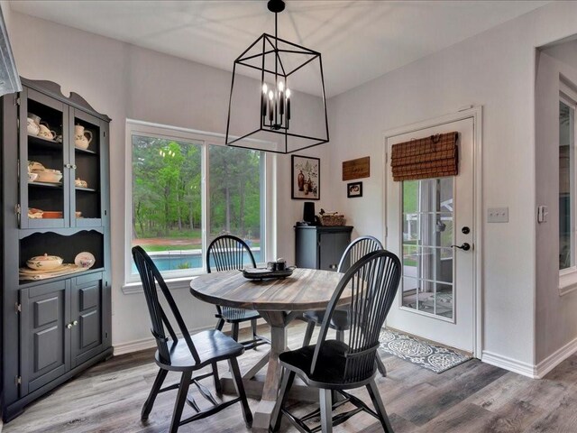 3065 S Fm 1194, Lufkin, TX 75904 - dining space with a notable chandelier, baseboards, and wood finished floors