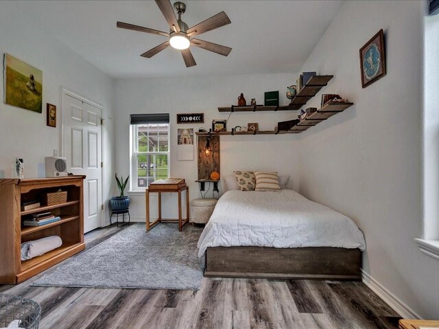 3065 S Fm 1194, Lufkin, TX 75904 - bedroom with baseboards, ceiling fan, and wood finished floors