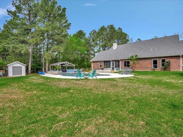 3065 S Fm 1194, Lufkin, TX 75904 - view of yard featuring a gazebo, an outdoor structure, a detached garage, a patio, and an outdoor pool