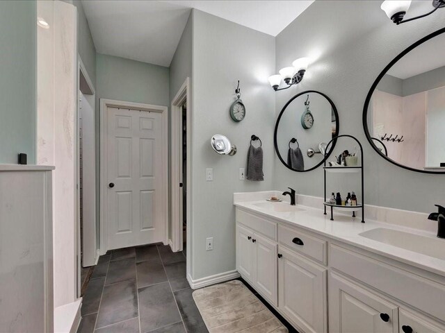 3065 S Fm 1194, Lufkin, TX 75904 - full bath featuring double vanity, baseboards, a sink, and tile patterned flooring