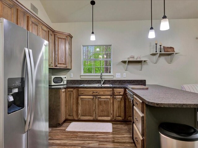 3065 S Fm 1194, Lufkin, TX 75904 - kitchen with a sink, open shelves, stainless steel refrigerator with ice dispenser, dark countertops, and white microwave