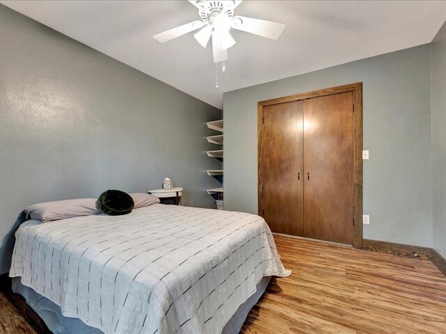 3065 S Fm 1194, Lufkin, TX 75904 - bedroom with baseboards, wood finished floors, and ceiling fan