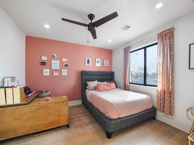 bedroom with light wood-style floors, recessed lighting, baseboards, and a ceiling fan