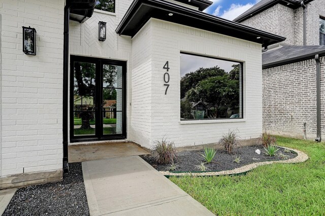 entrance to property with brick siding