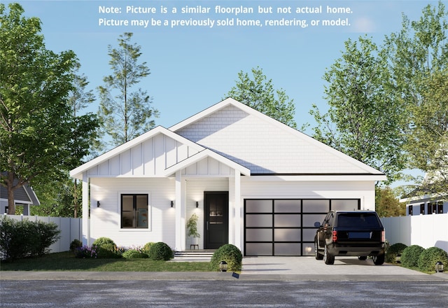 modern farmhouse with board and batten siding, an attached garage, fence, and gravel driveway