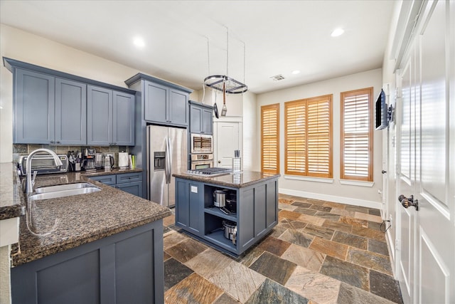 kitchen with a sink, open shelves, stainless steel appliances, visible vents, and recessed lighting