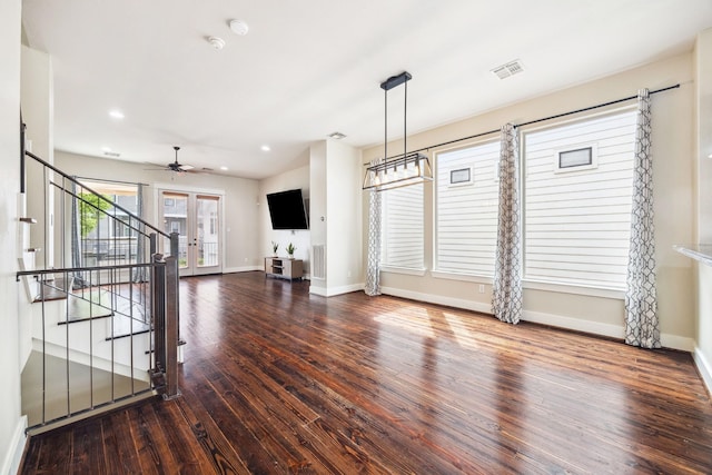 interior space featuring recessed lighting, baseboards, visible vents, hardwood / wood-style flooring, and stairway