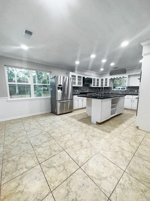 537 Natchez Park, Conroe, TX 77302 - kitchen featuring stainless steel fridge, dark countertops, decorative backsplash, white cabinets, and recessed lighting