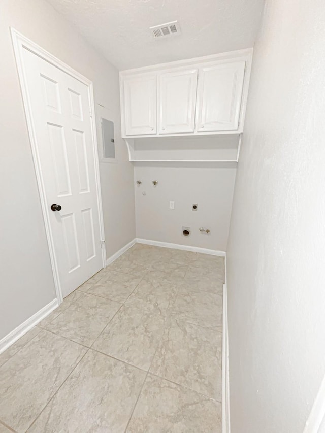 537 Natchez Park, Conroe, TX 77302 - laundry room with cabinet space, hookup for an electric dryer, hookup for a gas dryer, electric panel, and baseboards