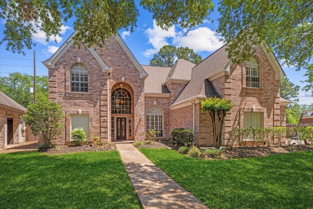 5206 Summer Snow Dr, Houston, TX 77041 - view of front of house with brick siding, a front lawn, and roof with shingles