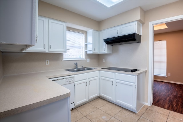 1910 Cobble Creek Dr, Houston, TX 77073 - kitchen featuring light tile patterned flooring, a sink, dishwasher, black electric cooktop, and under cabinet range hood