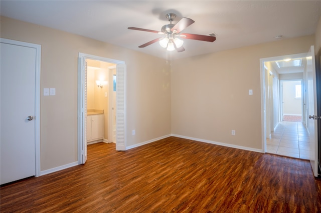 1910 Cobble Creek Dr, Houston, TX 77073 - unfurnished bedroom featuring baseboards, ceiling fan, and wood finished floors