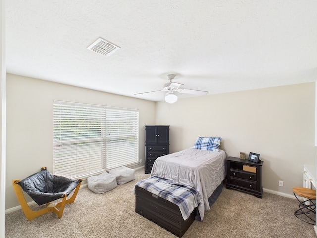 1310 Golden Bear Ln, Kingwood, TX 77339 - carpeted bedroom featuring a ceiling fan and baseboards