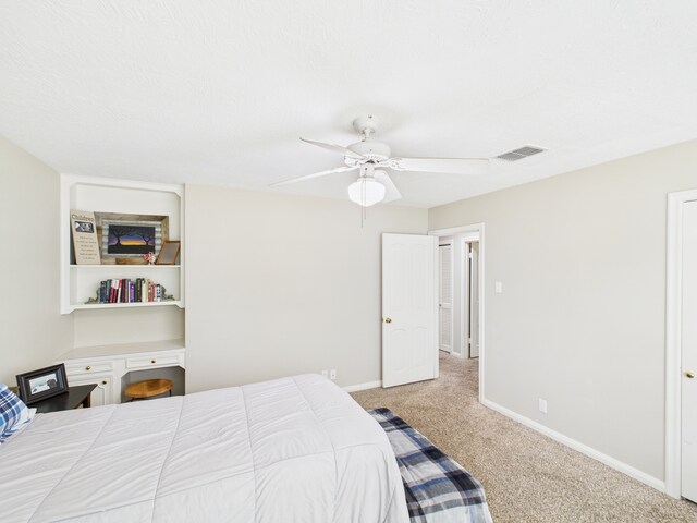 1310 Golden Bear Ln, Kingwood, TX 77339 - carpeted bedroom featuring baseboards and a ceiling fan