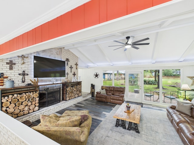 1310 Golden Bear Ln, Kingwood, TX 77339 - living area featuring wood finished floors, ceiling fan, and a brick fireplace
