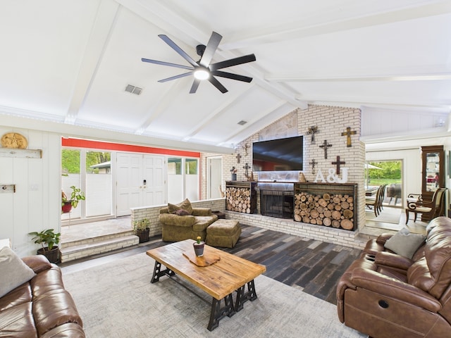 1310 Golden Bear Ln, Kingwood, TX 77339 - living room featuring ceiling fan, wood finished floors, a fireplace, and healthy amount of natural light