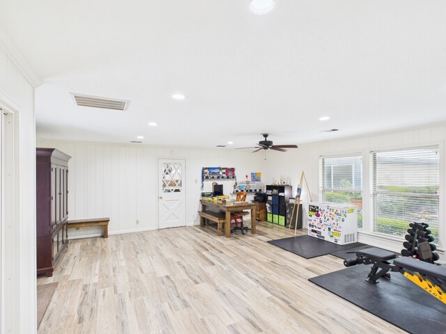 1310 Golden Bear Ln, Kingwood, TX 77339 - workout room with light wood-type flooring, a ceiling fan, recessed lighting, and a decorative wall