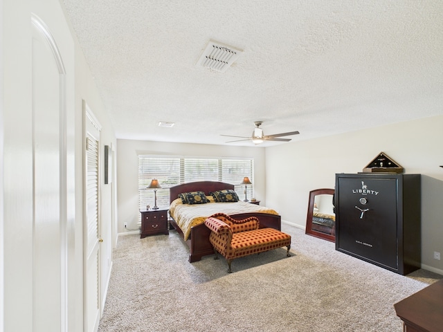 1310 Golden Bear Ln, Kingwood, TX 77339 - bedroom featuring carpet flooring, a textured ceiling, baseboards, and ceiling fan
