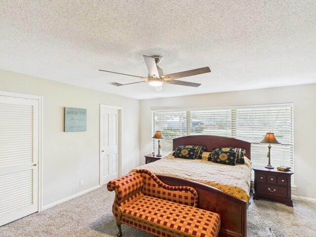1310 Golden Bear Ln, Kingwood, TX 77339 - carpeted bedroom with baseboards, a ceiling fan, and a textured ceiling