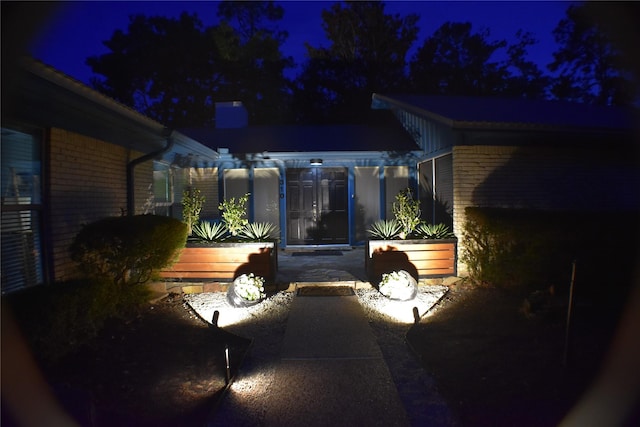 1310 Golden Bear Ln, Kingwood, TX 77339 - view of patio at night