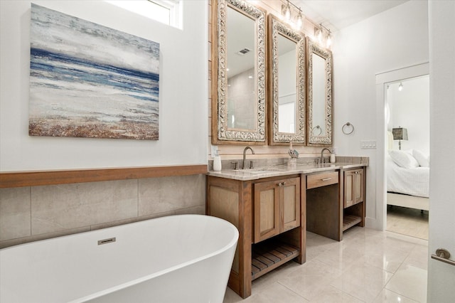 986 Bolivar Dunes Blvd, Gilchrist, TX 77617 - ensuite bathroom featuring a freestanding tub and double vanity