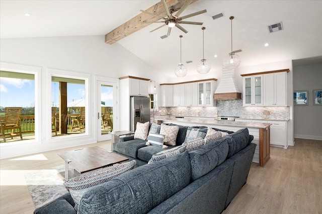 986 Bolivar Dunes Blvd, Gilchrist, TX 77617 - living room with a ceiling fan, beamed ceiling, light wood-style flooring, recessed lighting, and high vaulted ceiling