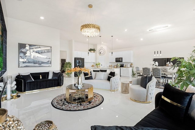living area with an inviting chandelier, tile patterned floors, and recessed lighting
