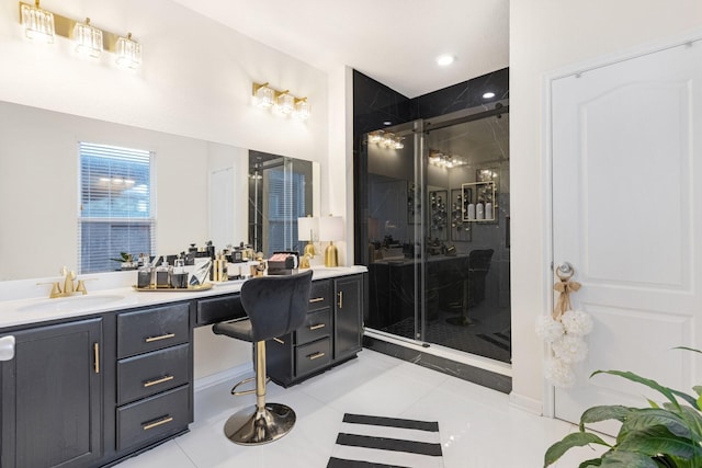 full bath with a stall shower, tile patterned flooring, and vanity