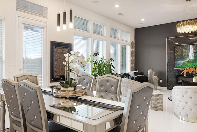 tiled dining area with an inviting chandelier, recessed lighting, baseboards, and visible vents