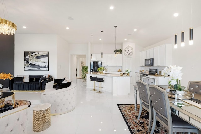 dining room with recessed lighting and light tile patterned floors